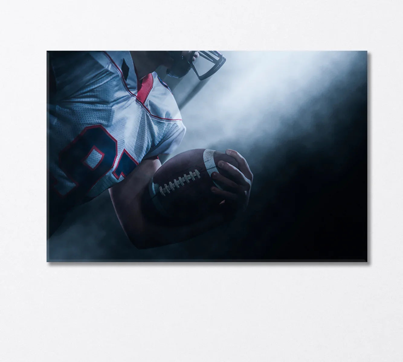 American football close-up with dramatic light — canvas wall art